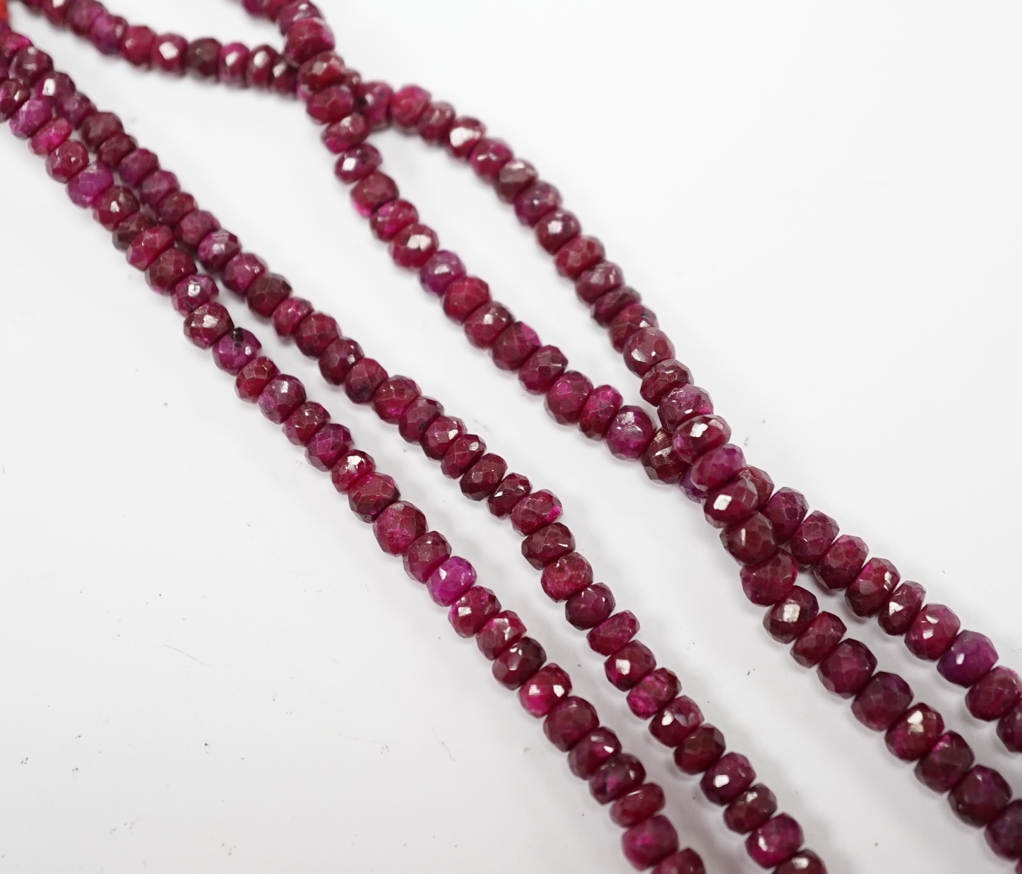 An Indian double strand facetted ruby bead necklace, ruby section only 38cm. Fair condition.